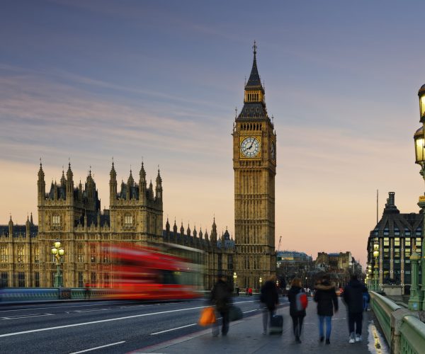 UK, London, Big Ben, Houses of Parliament and bus on Westminster Bridge at dusk